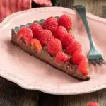 a slice of chocolate raspberry tart.