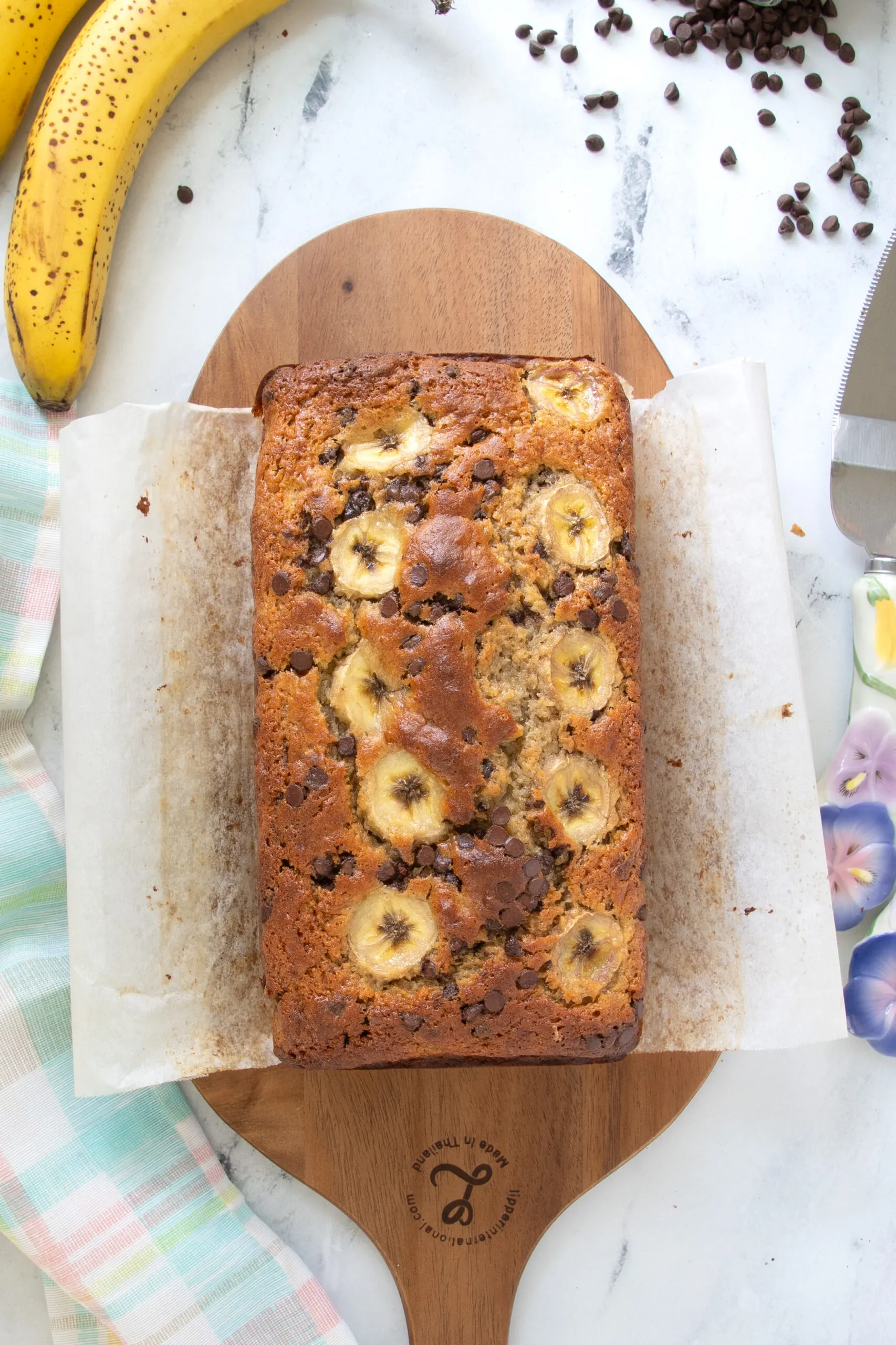 a loaf of sourdough banana bread in a cutting board.