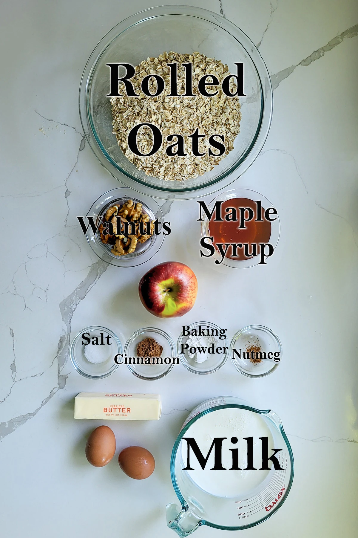 ingredients for apple baked oatmeal in glass bowls.