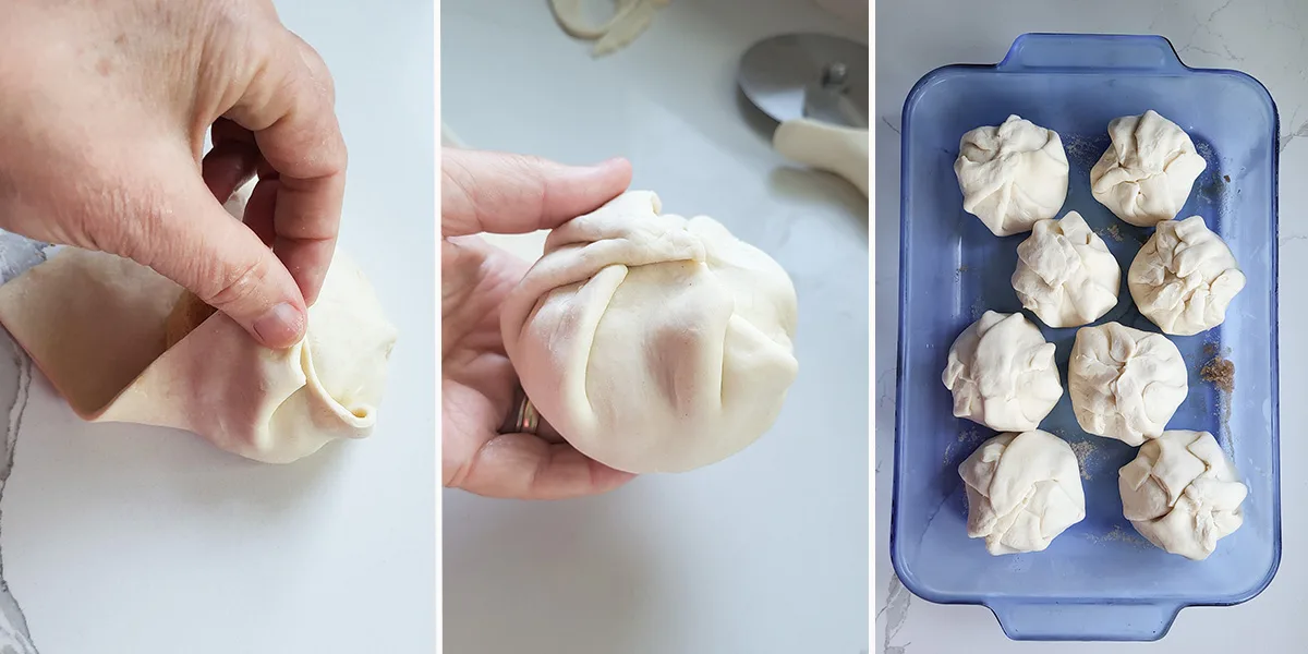 A hand wrapping an apple half in dough. Dough wrapped apples in a blue baking pan.