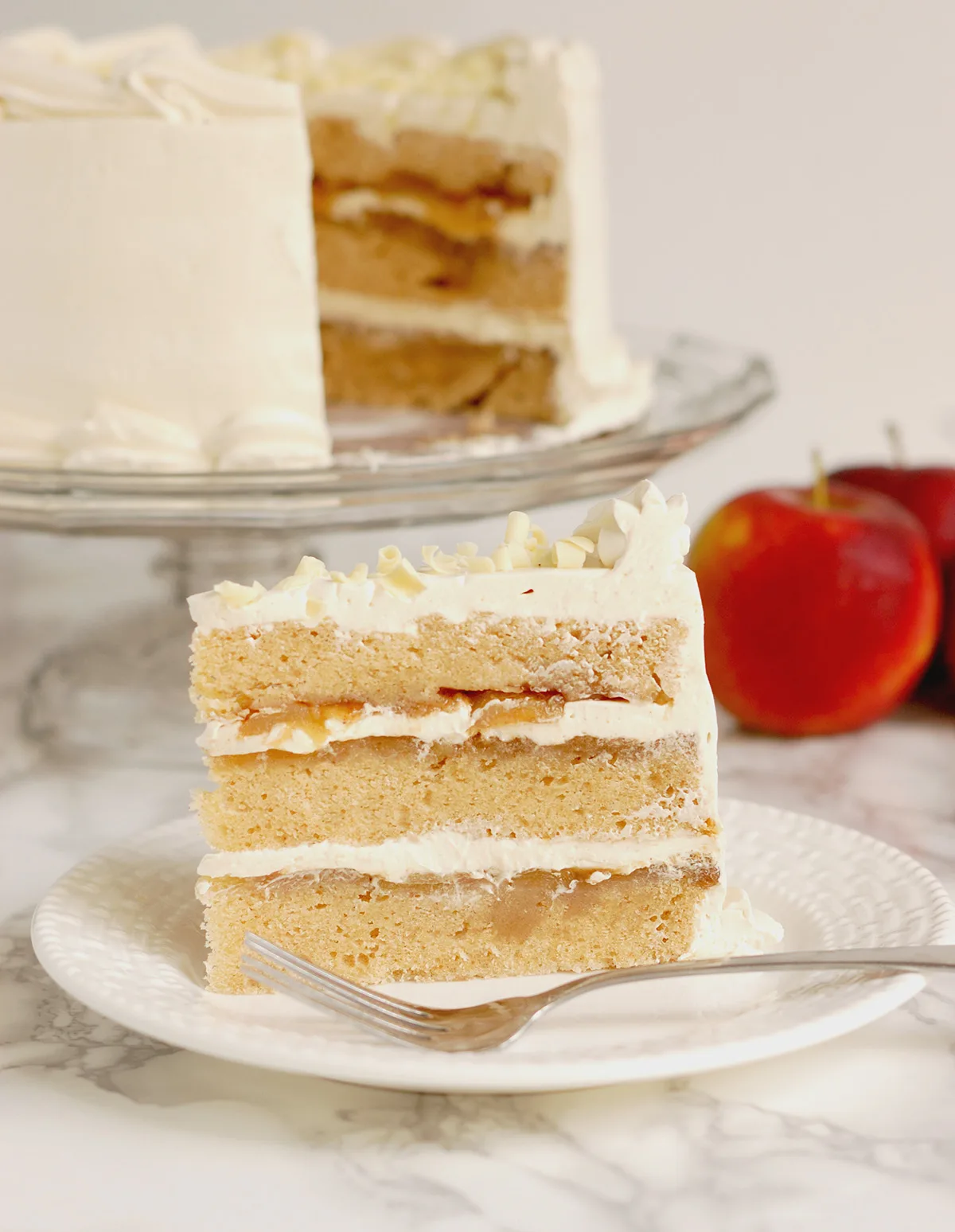 a slice of cake standing on a white plate.