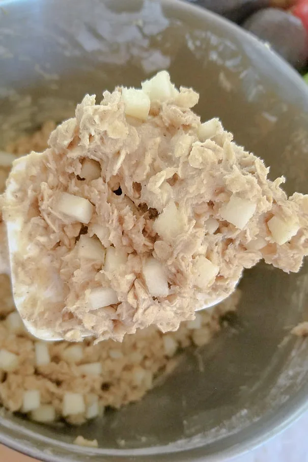 a blob of apple oatmeal cookie dough on a spatula.