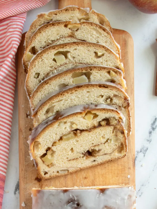 slices of apple cinnamon bread on a cutting board.