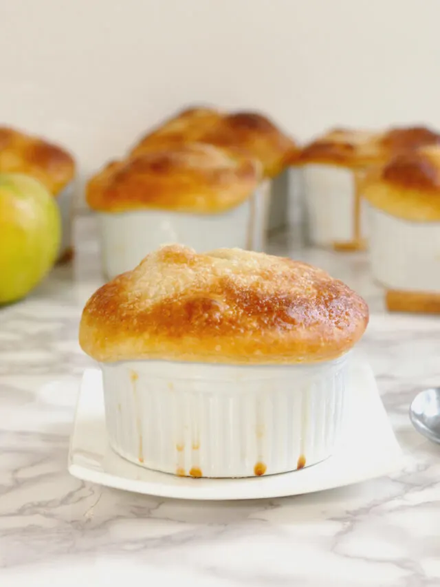 an apple pot pie on a plate.