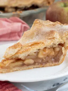 a slice of apple pie on a plate.