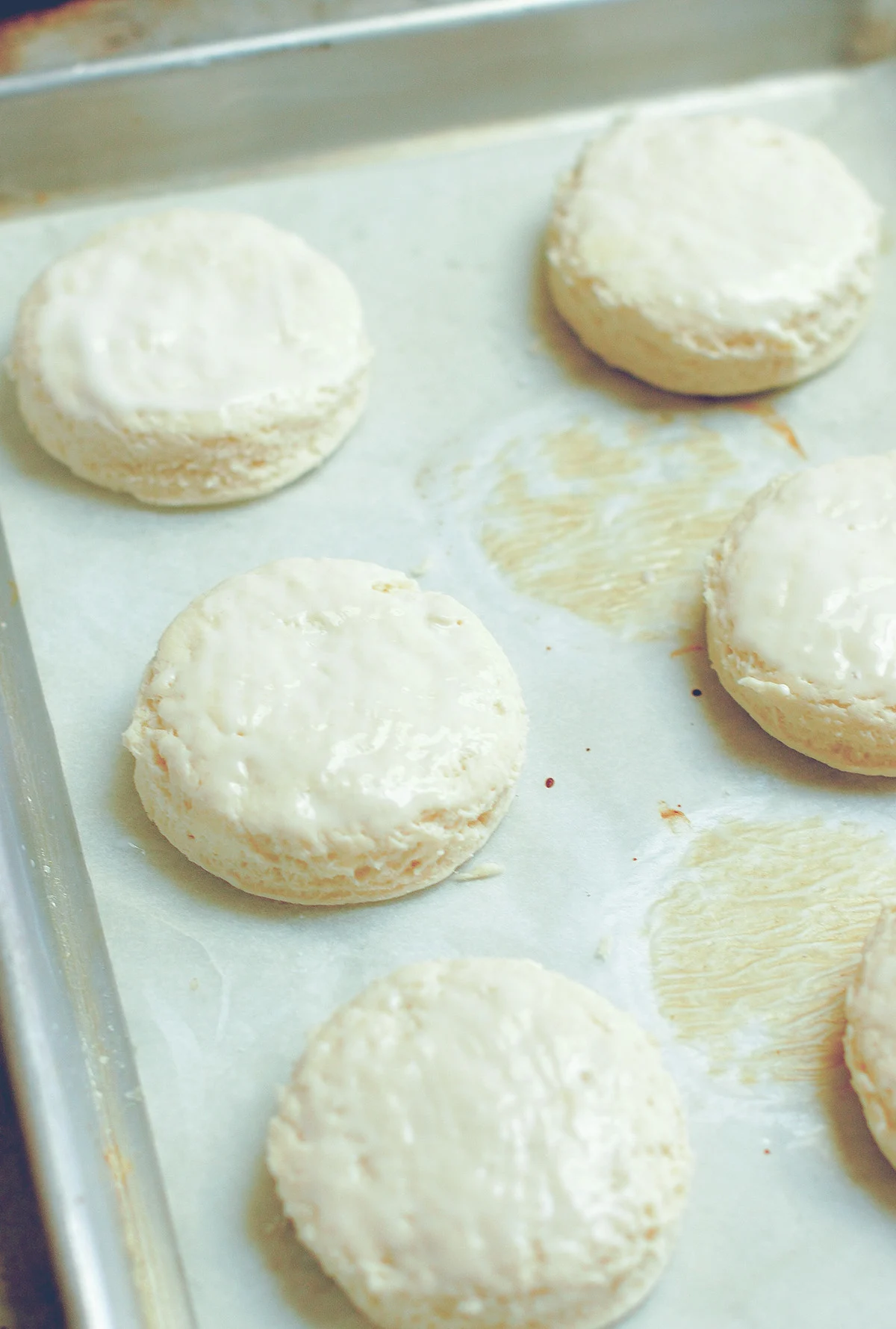 unbaked biscuits on a baking sheet.