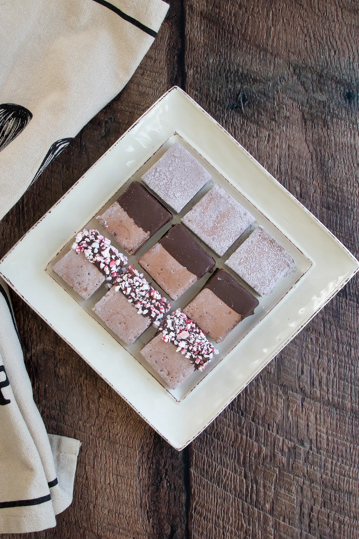chocolate marshmallows on a square plate.