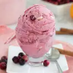 A pinterest image for cranberry ice cream with text overlay.