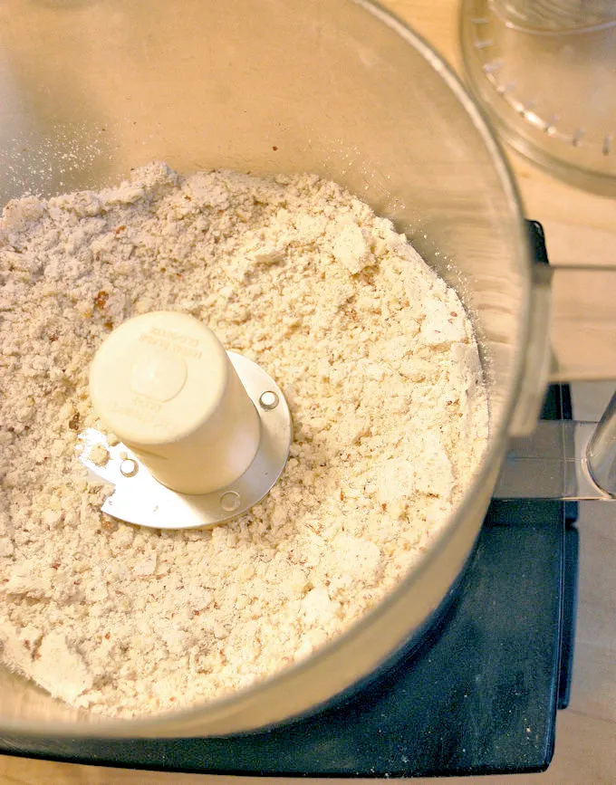 a food process filled with ground nuts and flour.