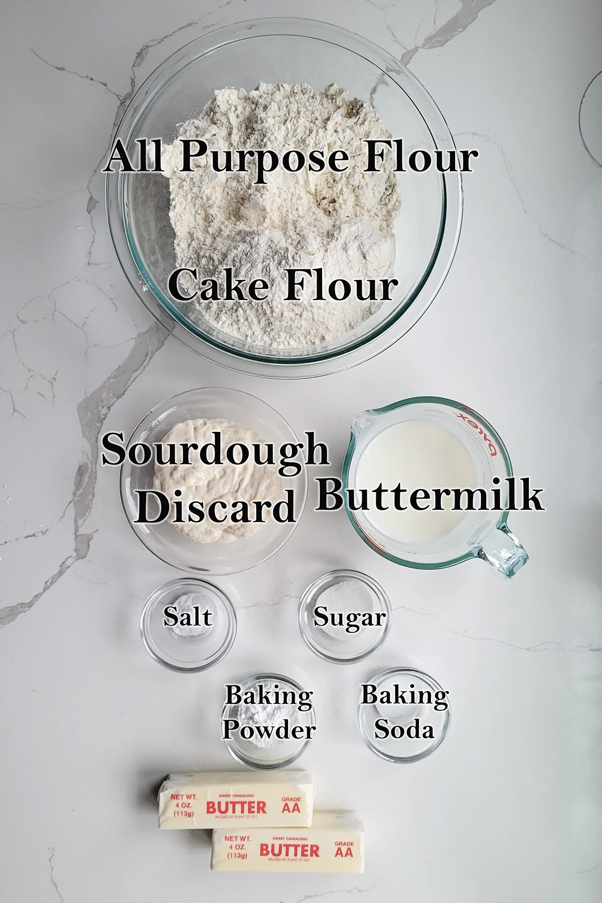 ingredients for sourdough biscuits in glass bowls.