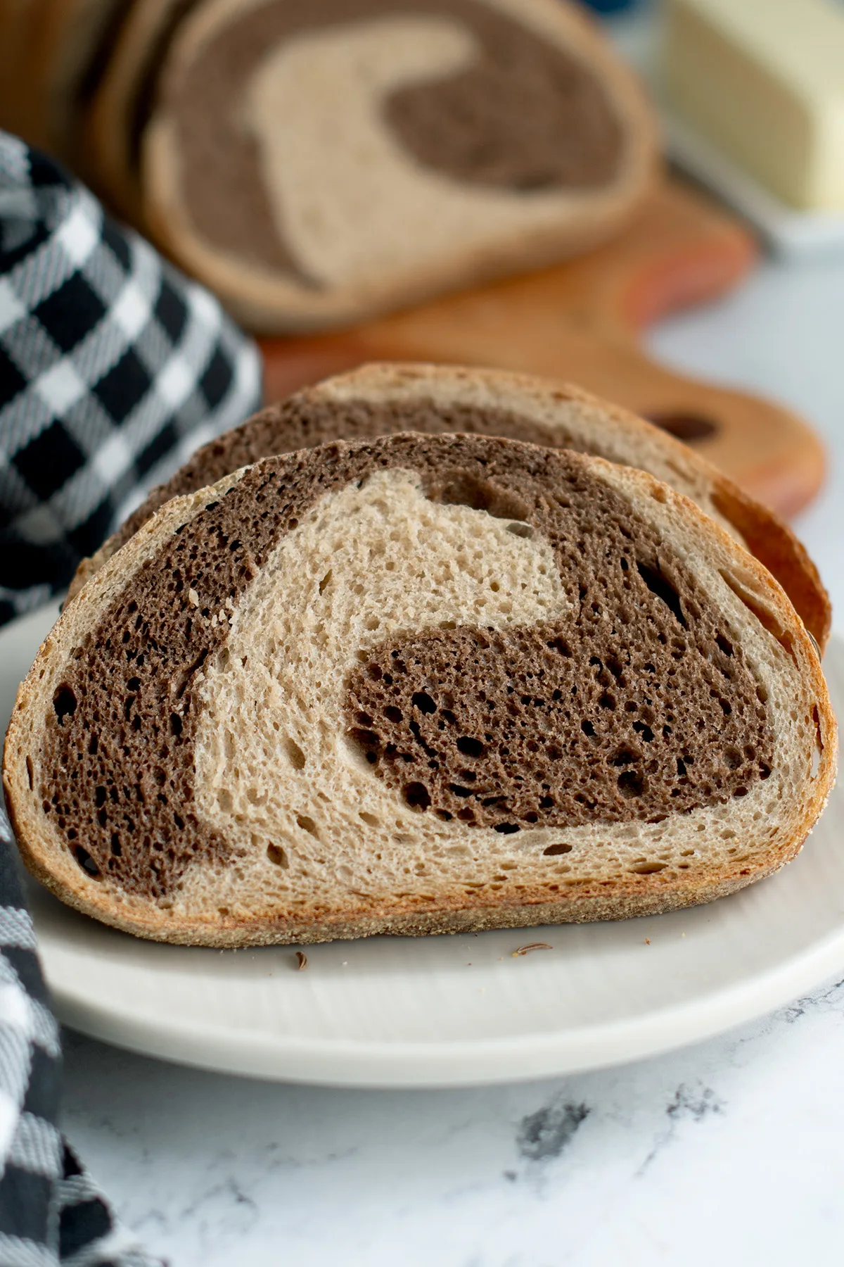 a slice of marble bread on a white plate.