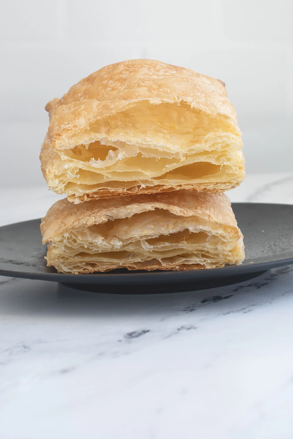 a cross section of baked puff pastry showing layers.