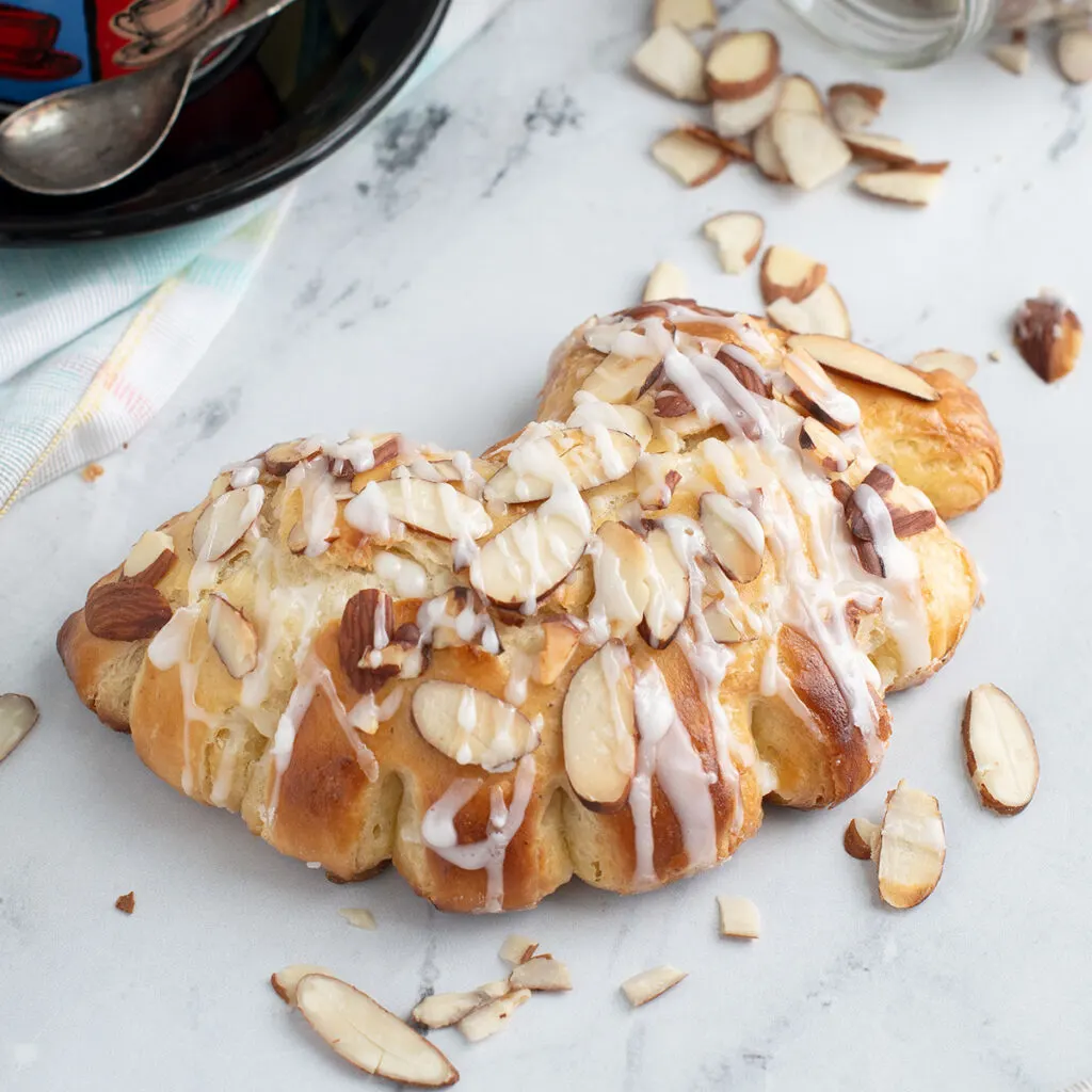 a bear claw pastry on a marble surface.