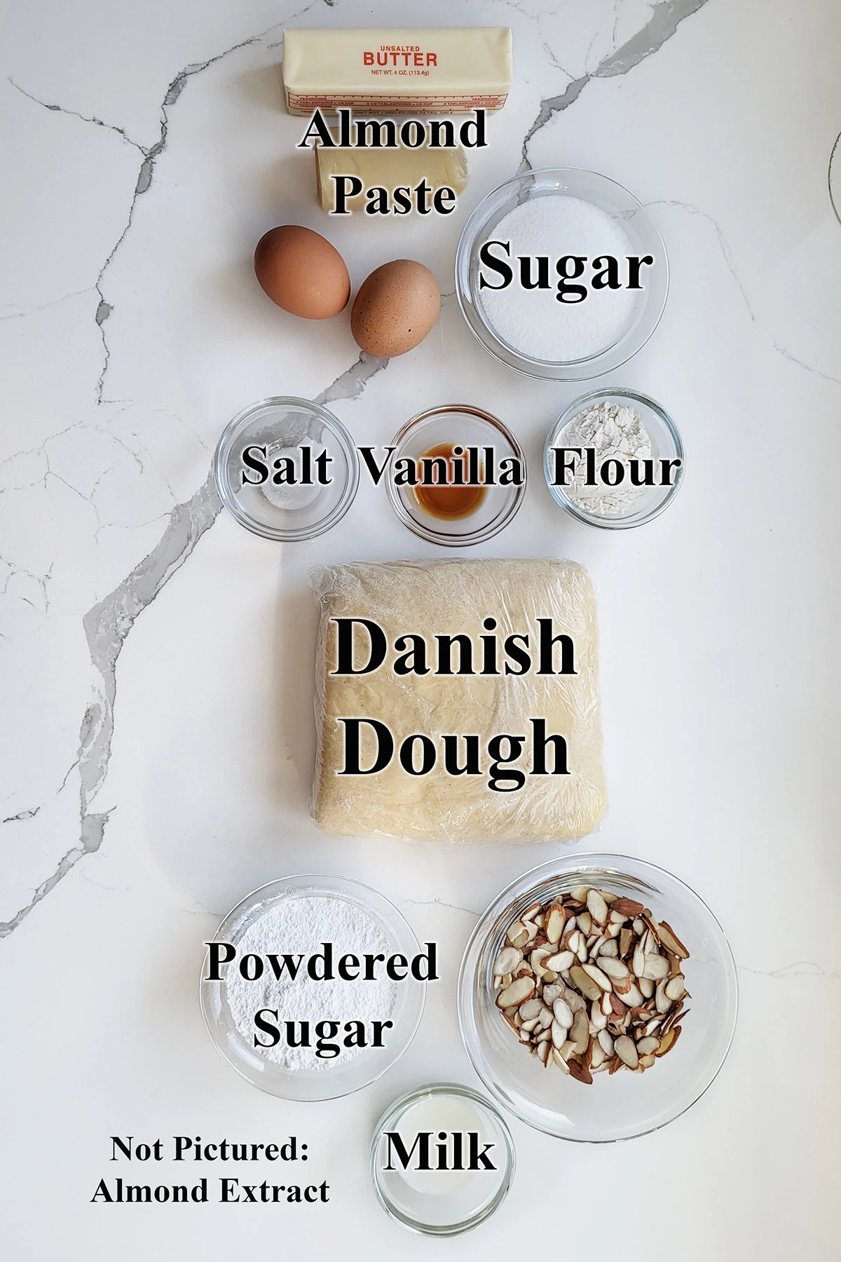 ingredients for bear claw pastries in glass bowls.