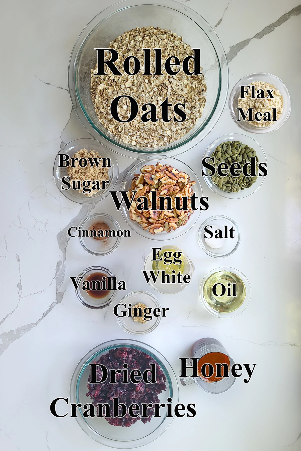 ingredients for granola in glass bowls.