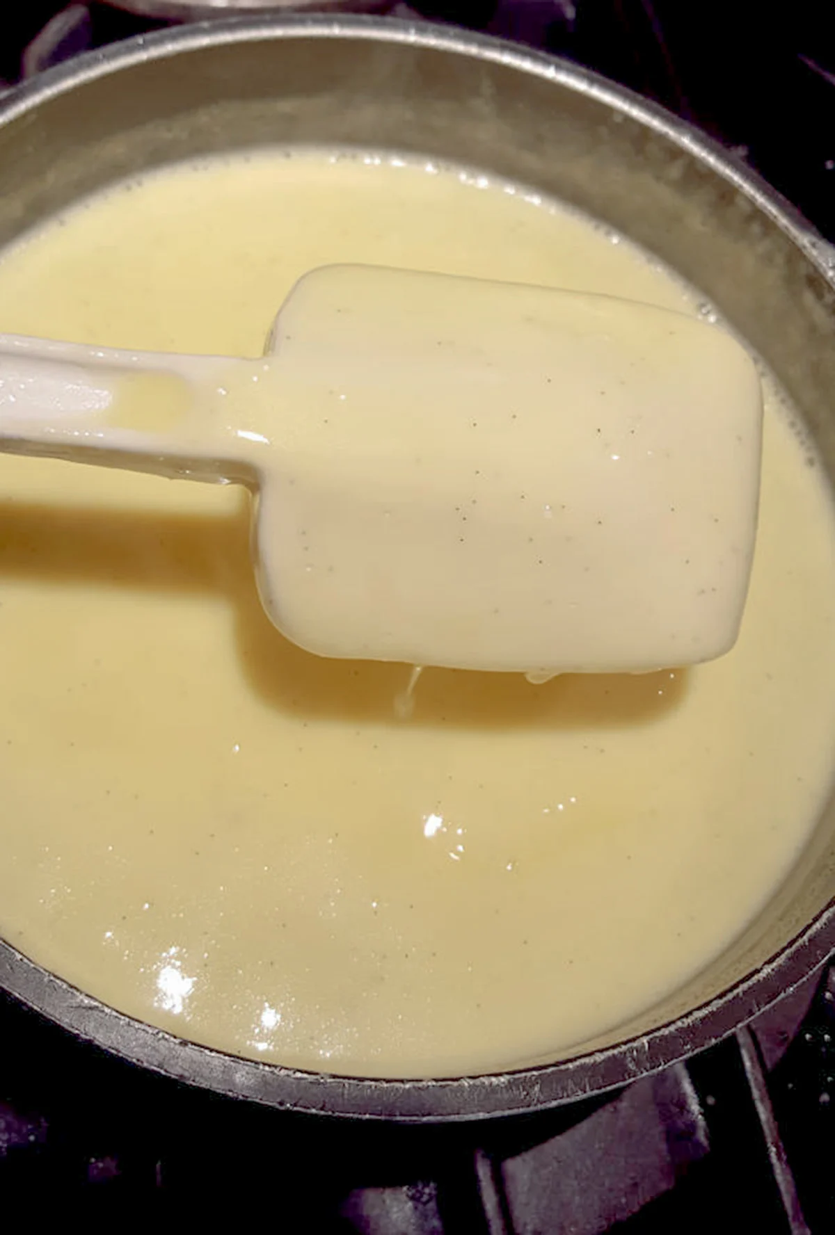 a spatula covered with custard.