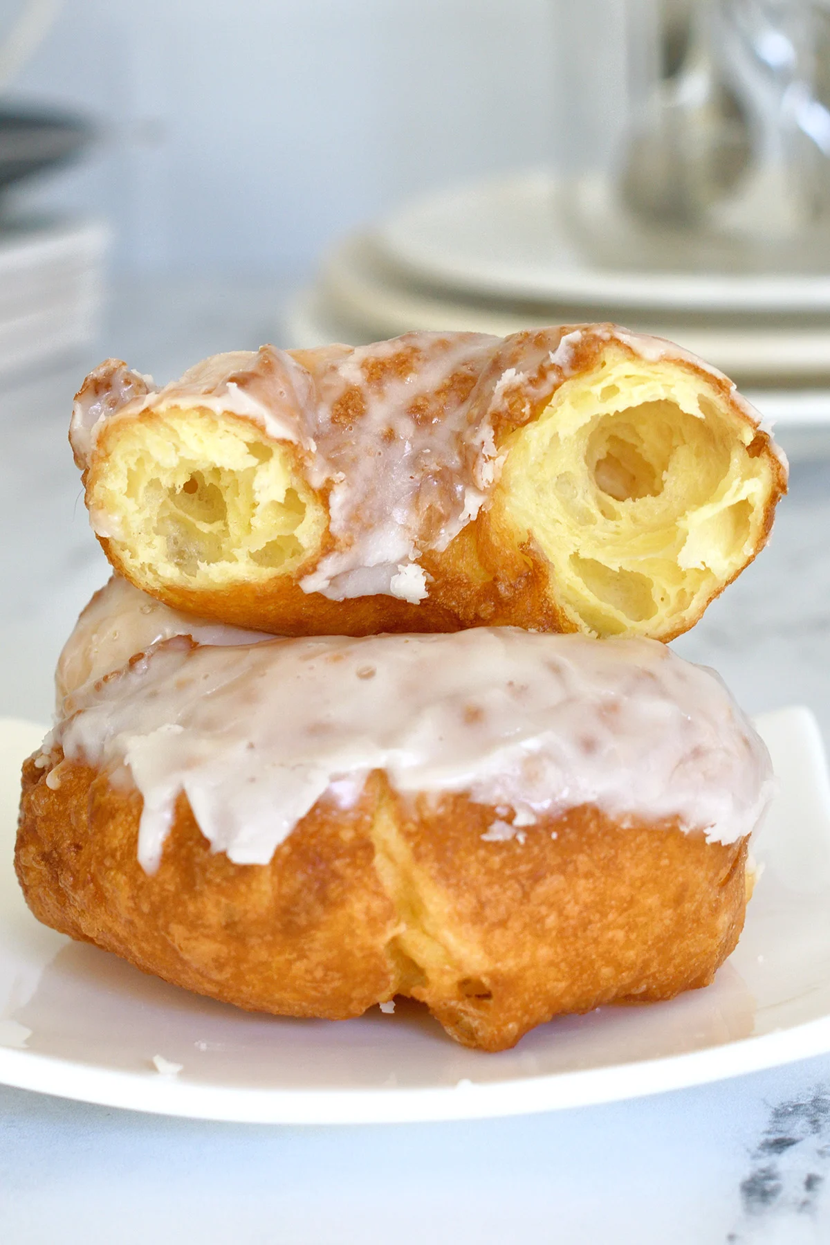 a french cruller donut on a plate.