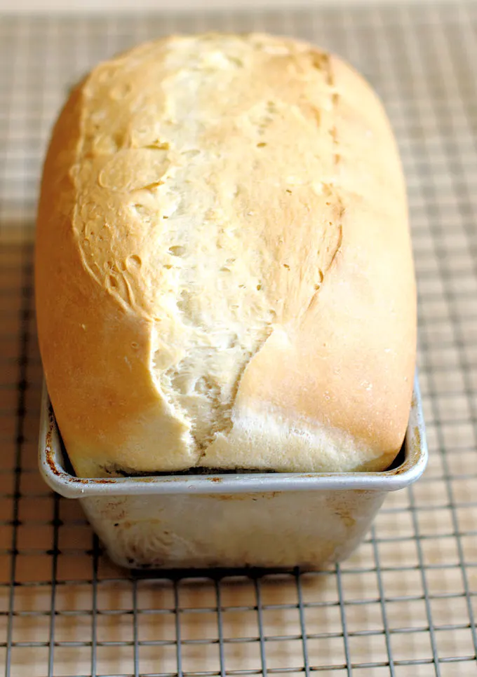 a loaf of white bread in a pan.