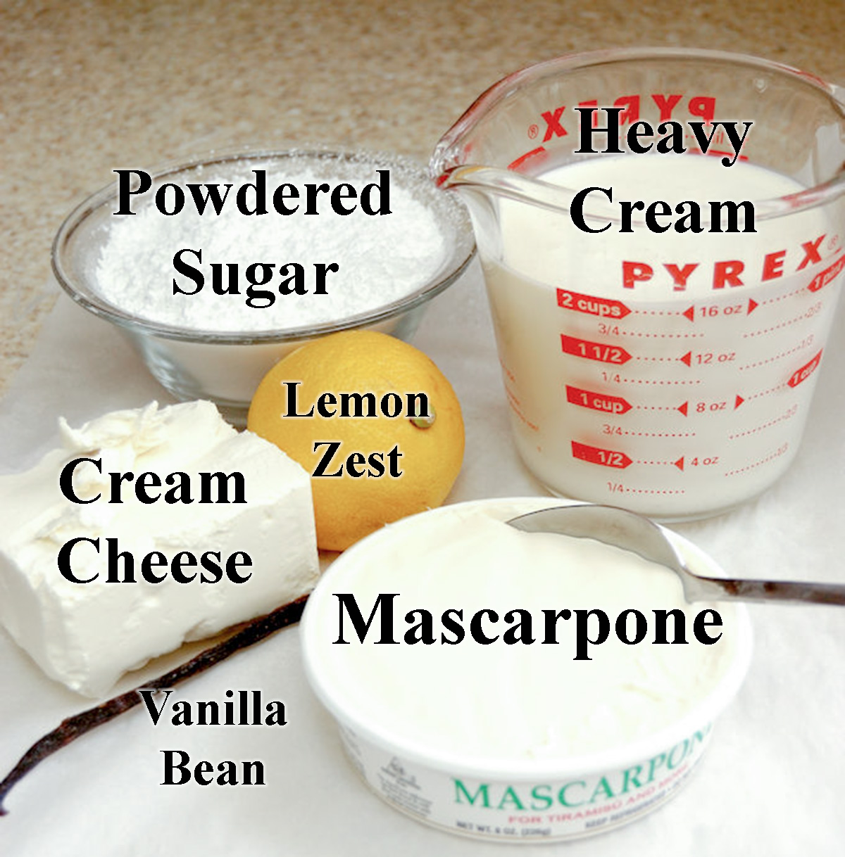 ingredients for cream heart measured in bowls.