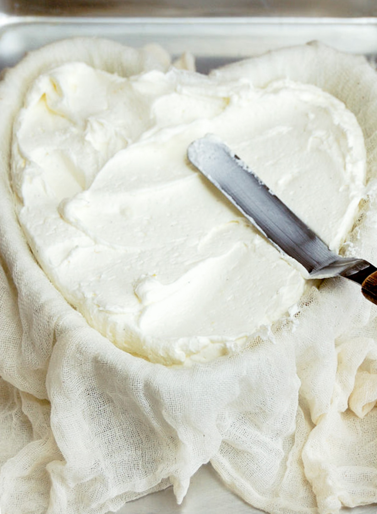 heart shaped bowl filled with cream.