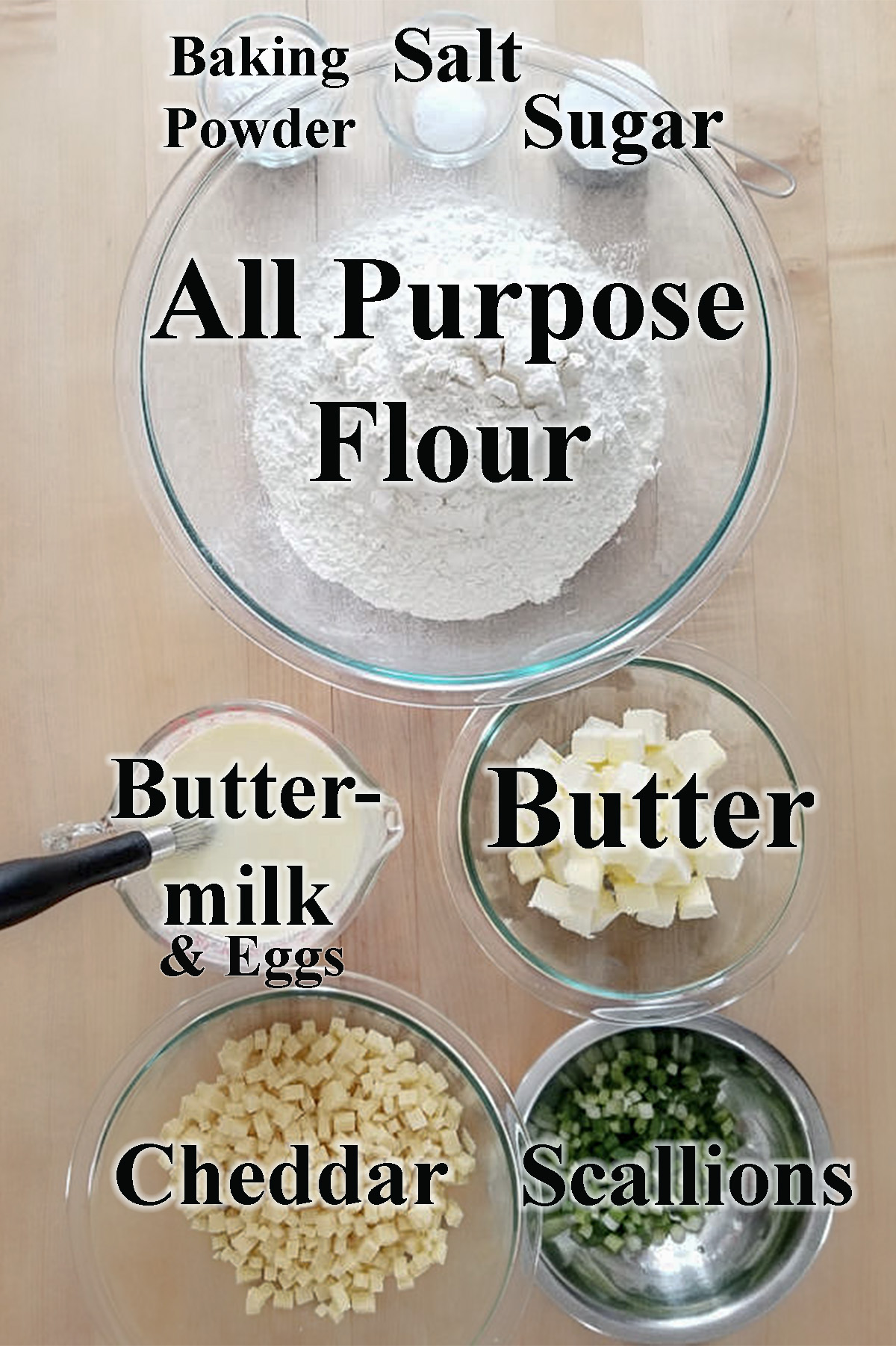 ingredients for cheese scones in glass bowls.