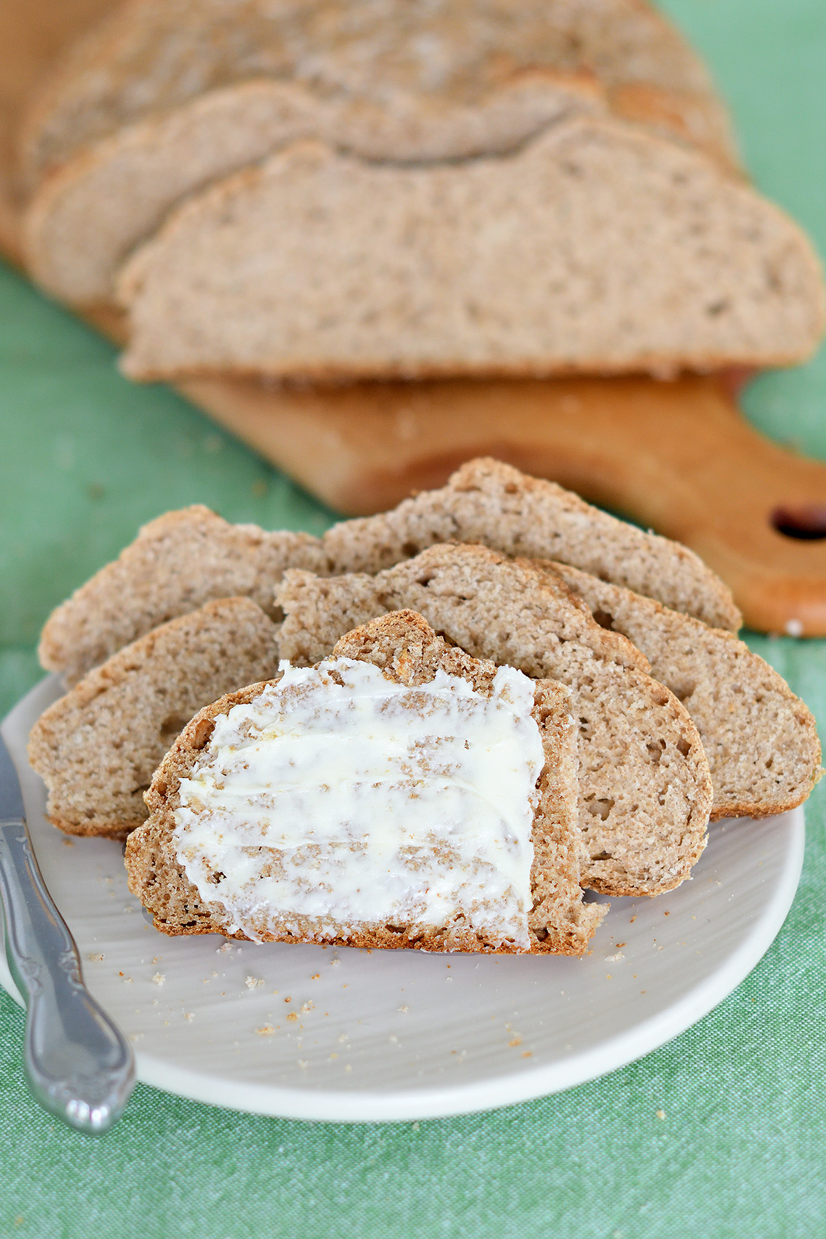 sliced of irish brown bread on a white plate.