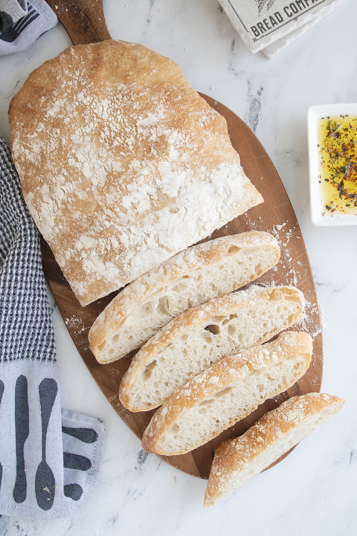 a loaf of sliced bread on a cutting board.