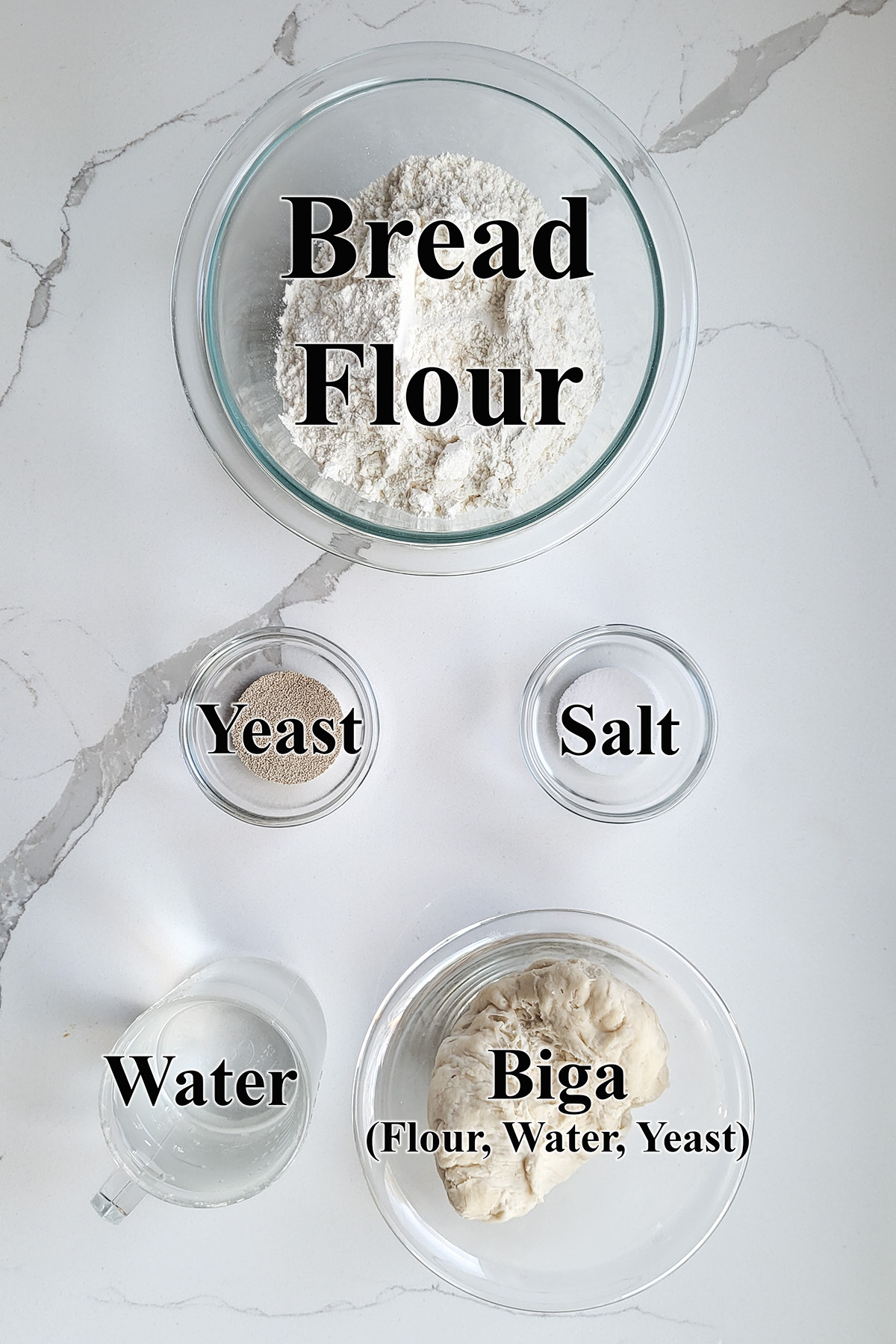 ingredients for ciabatta bread in glass bowls.