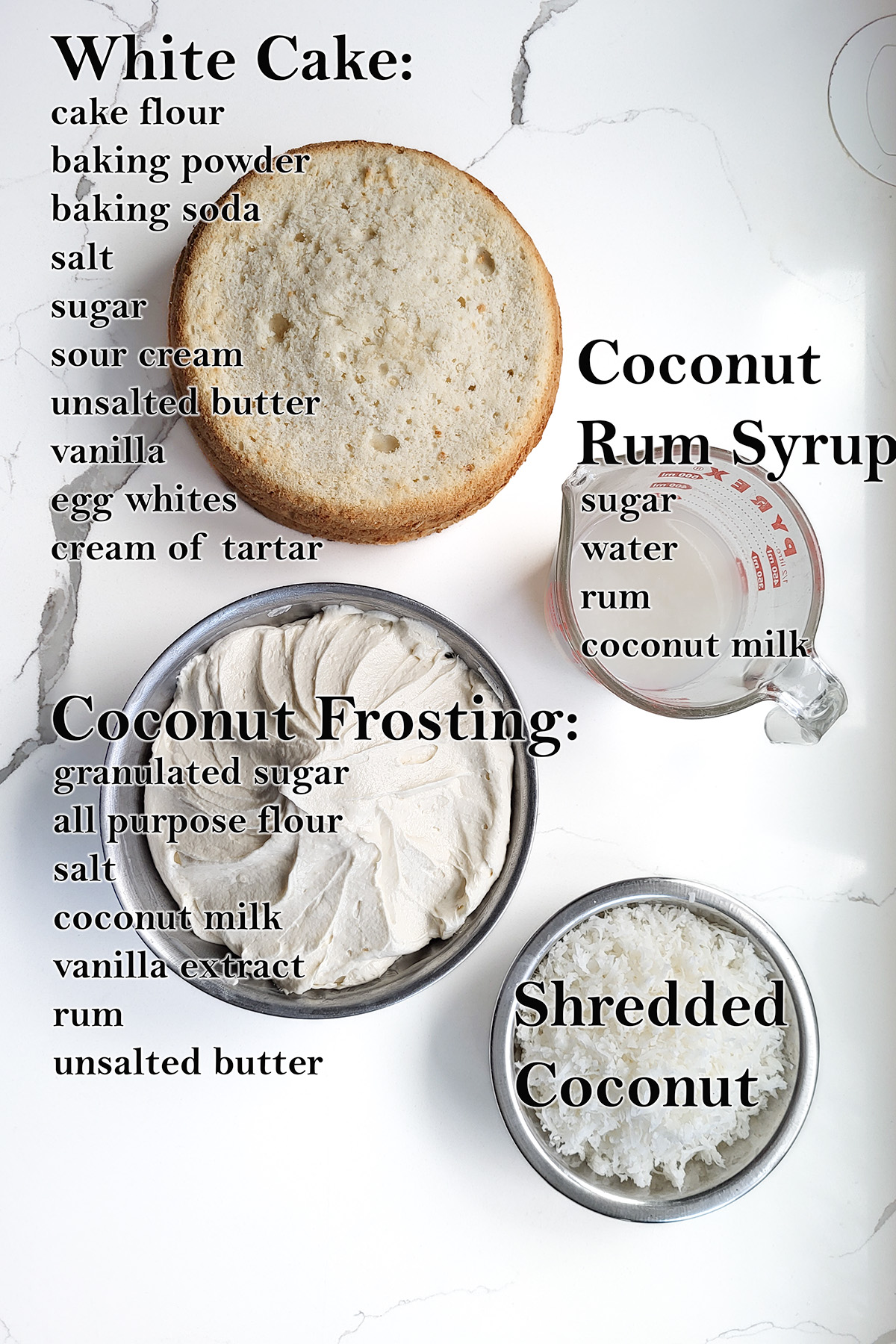 ingredients for making coconut cake on a white surface.