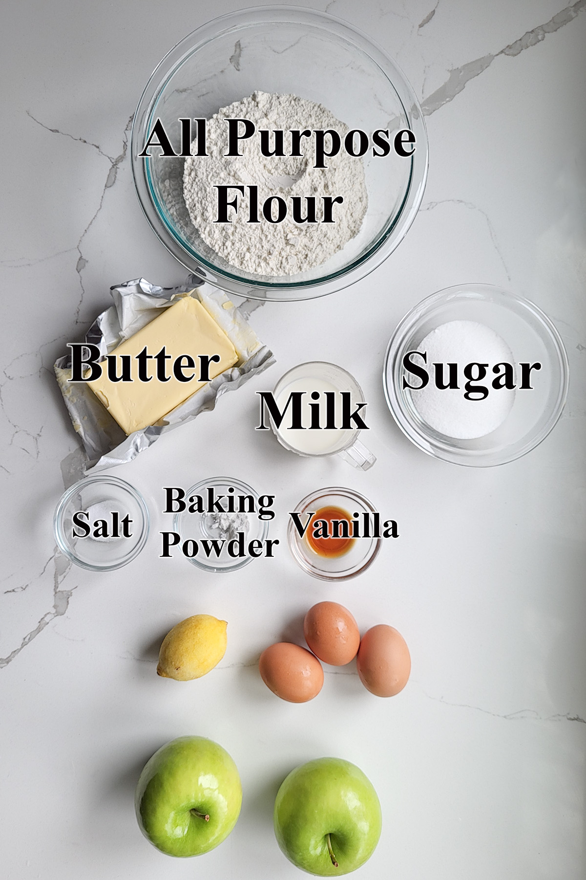 ingredients for irish apple cake in glass bowls.