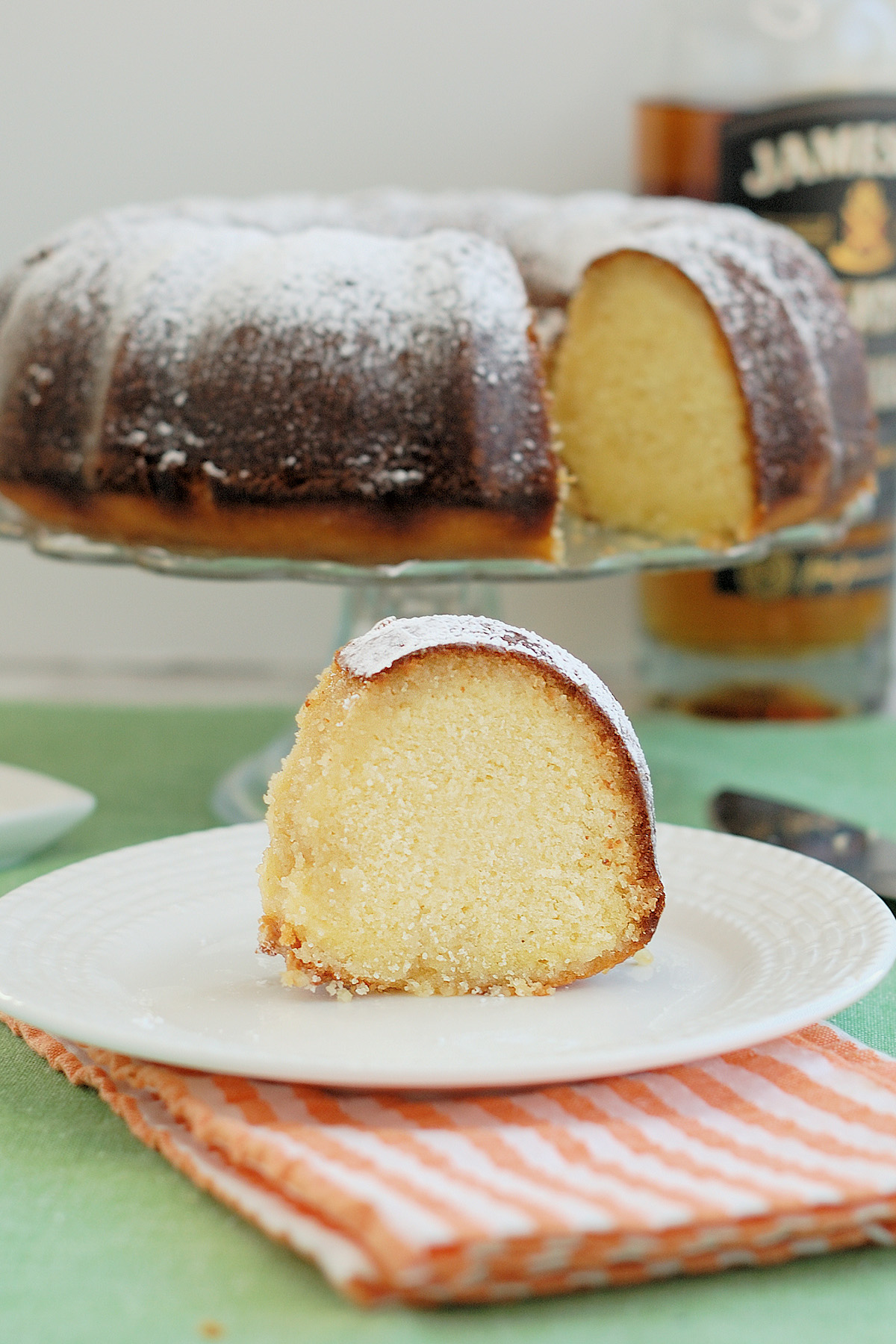 a slice of irish whiskey cake on a plate.