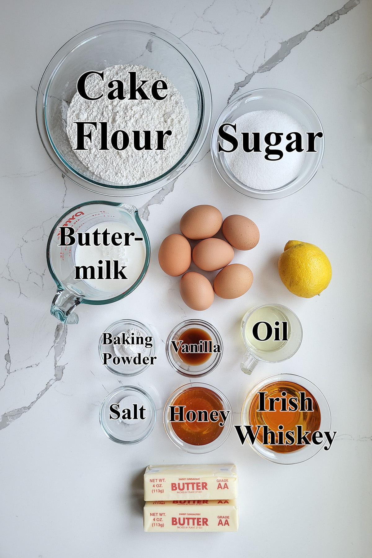 Ingredients for Irish Whiskey cake in glass bowls.