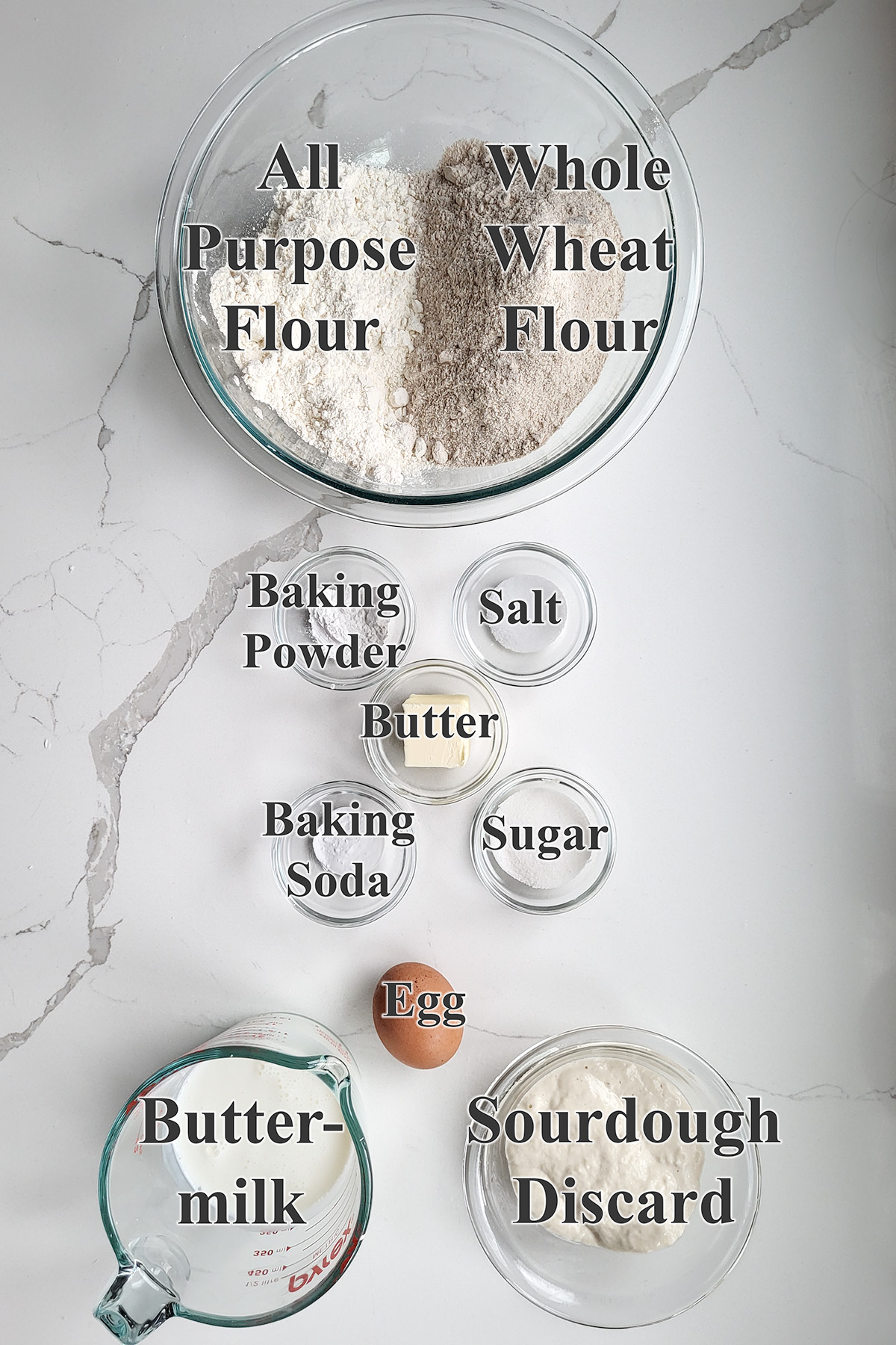 ingredients for sourdough irish brown bread in glass bowls.