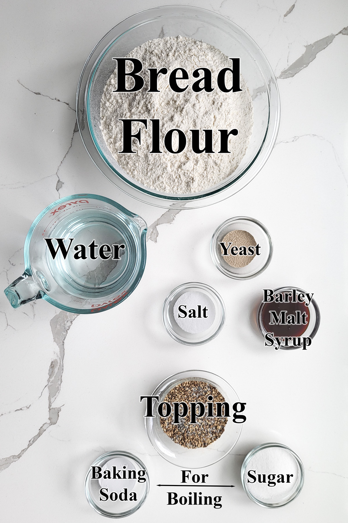 ingredients for bagels in glass bowls with text overlay.