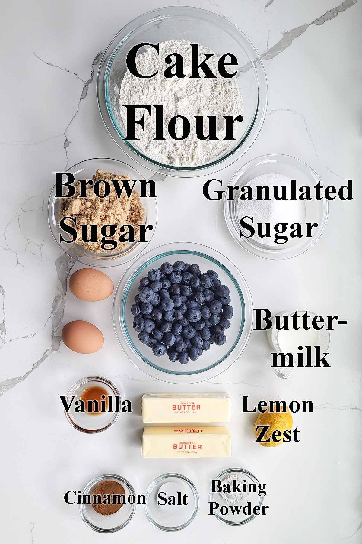 ingredients for blueberry coffee cake in glass bowls.