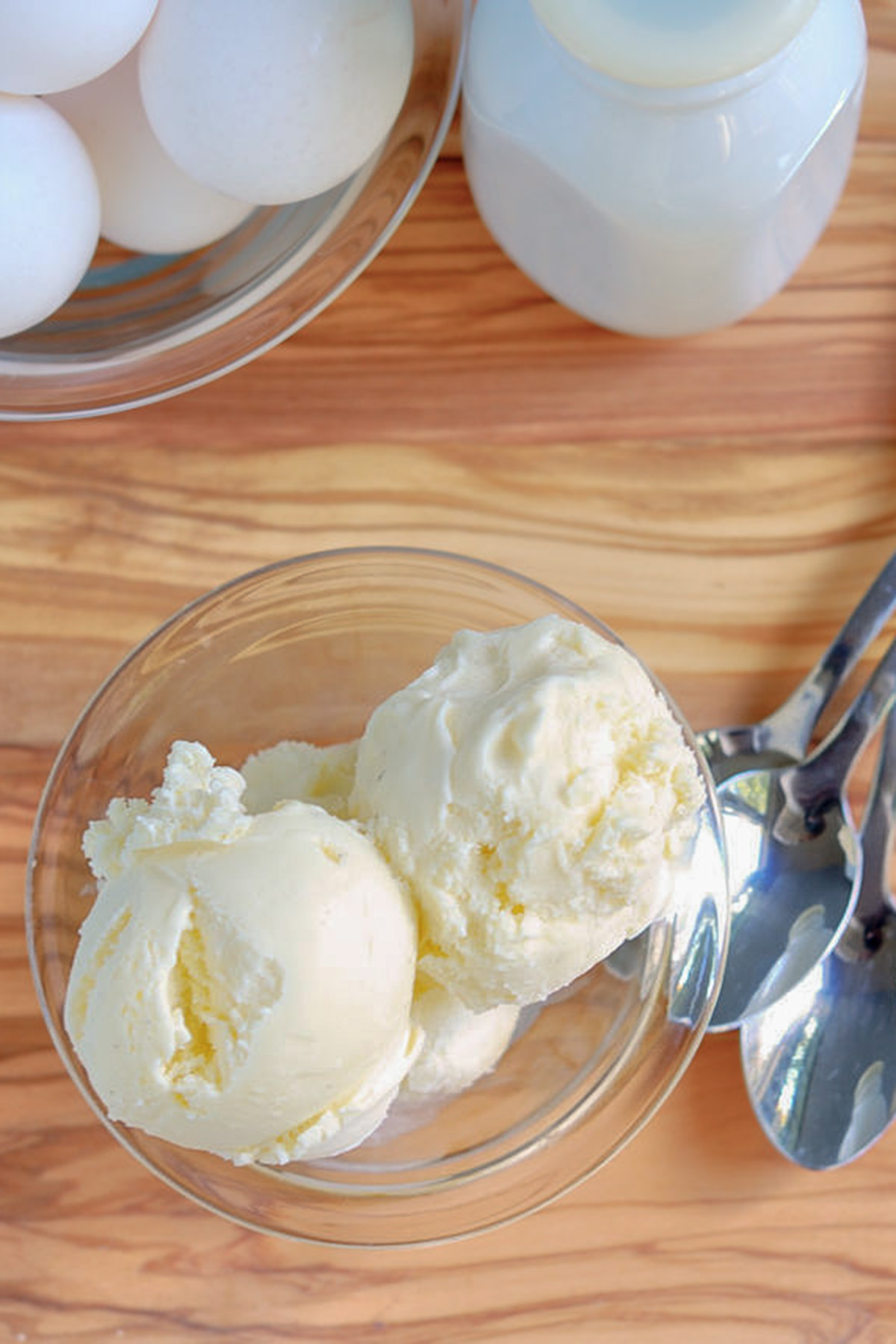 a bowl of ice cream in a wood table.