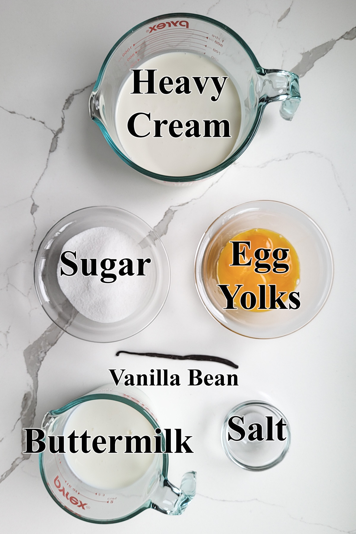 Ingredients for buttermilk ice cream in glass bowls.