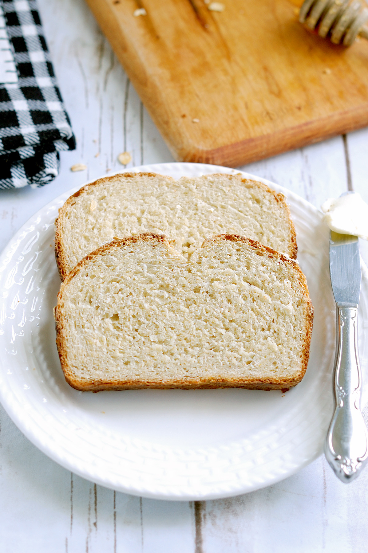 slices of oatmeal bread on a white plate.