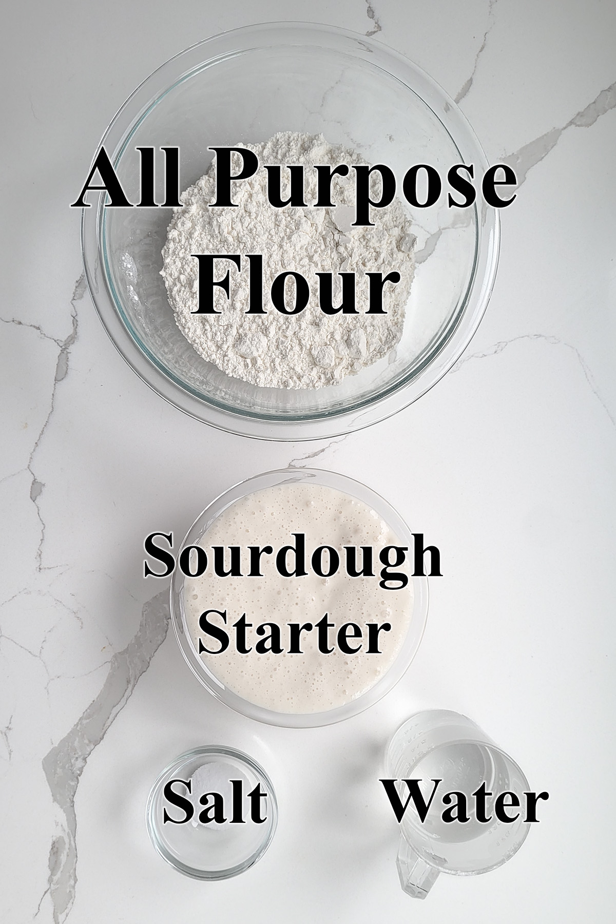 ingredients for sourdough baguettes in glass bowls