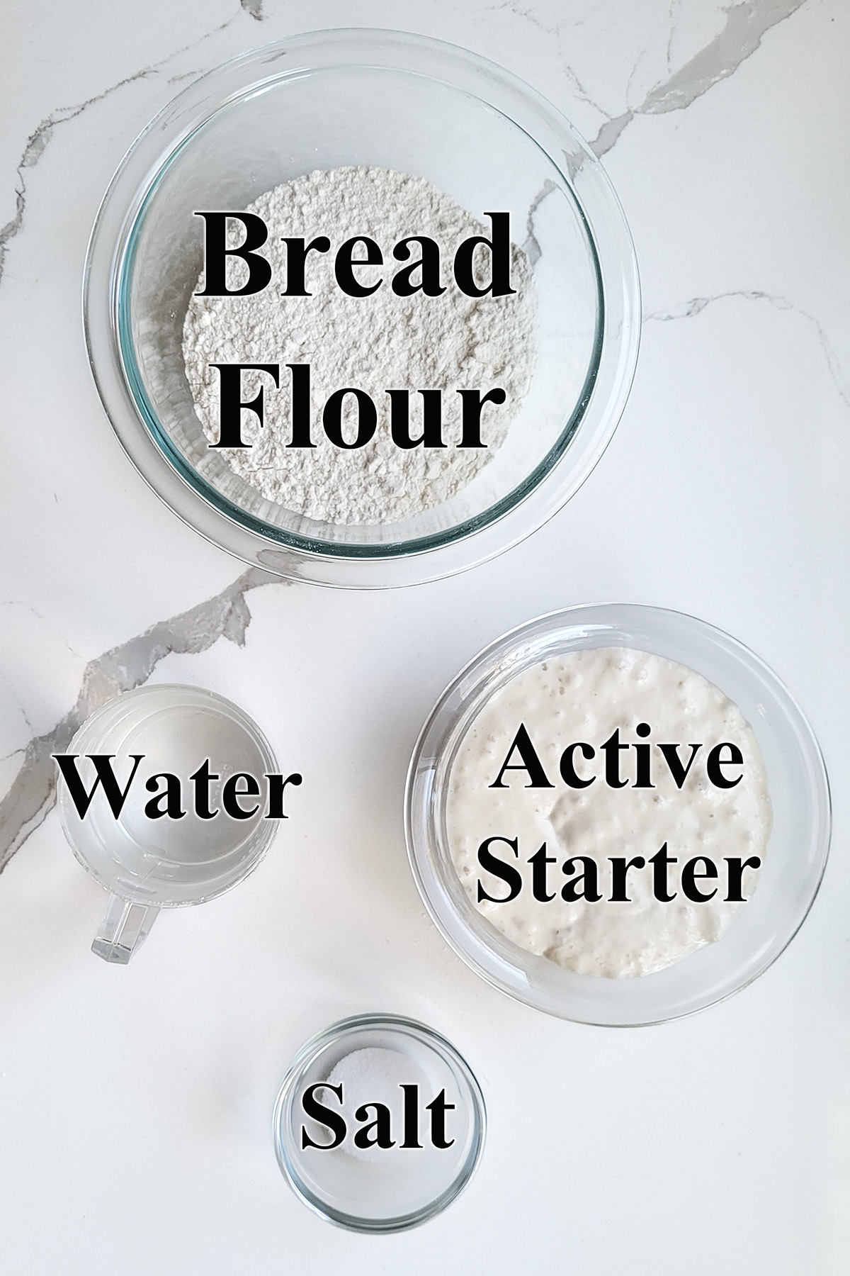 ingredients for sourdough ciabatta bread in glass bowls.