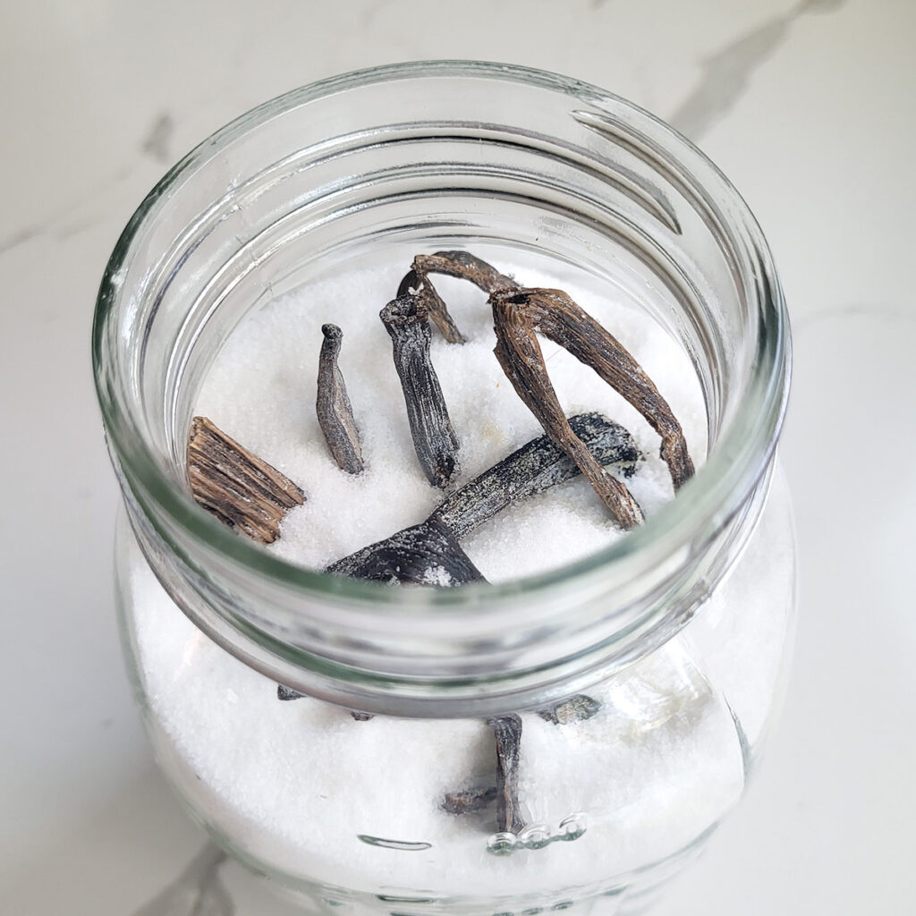 a JAR filled with sugar and vanilla beans.