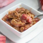 a pinterest image for rhubarb crisp with text overlay.