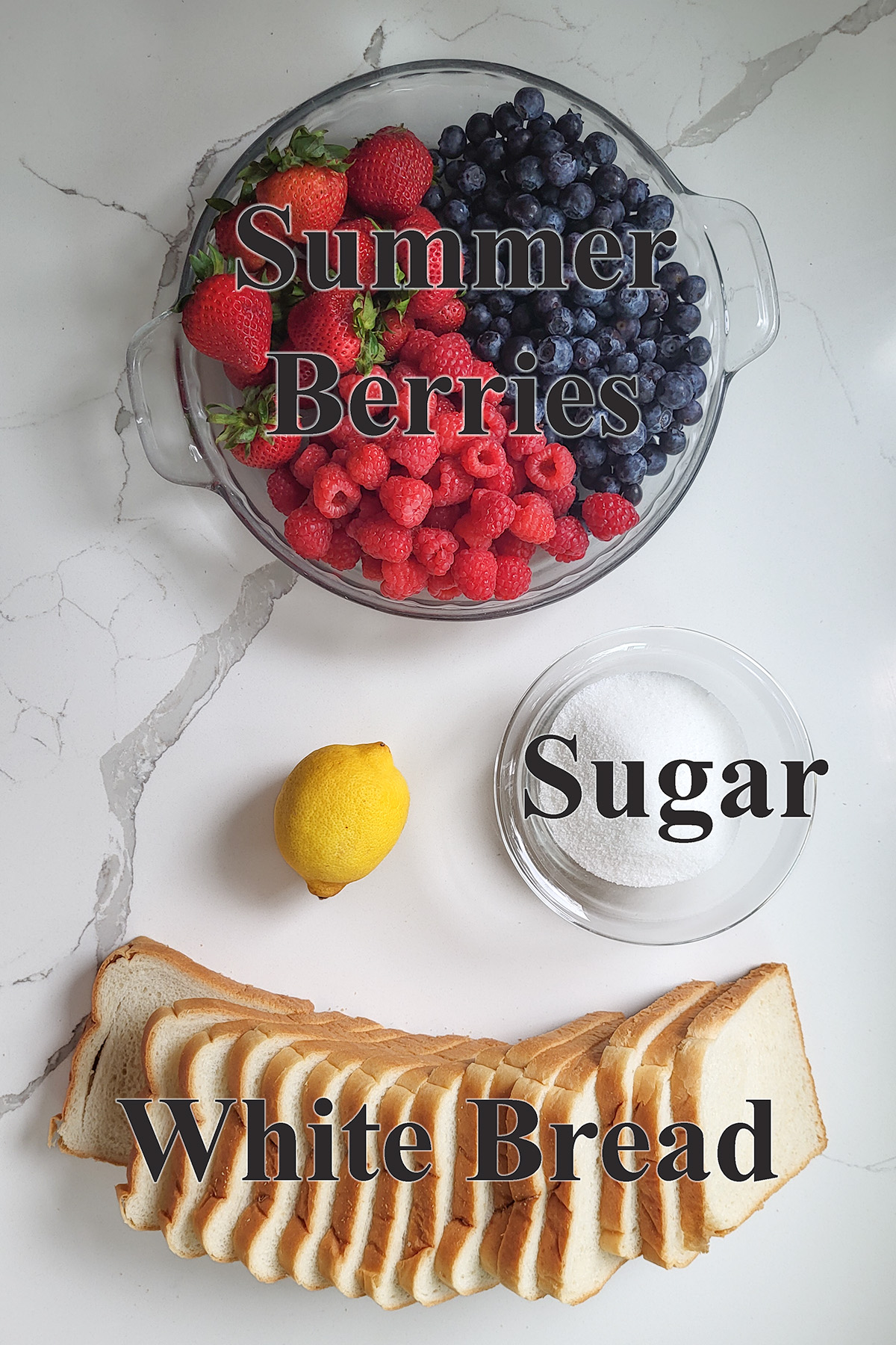 ingredients for summer berry pudding in glass bowls on a white surface.