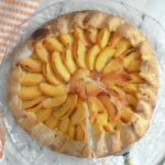 a pinterest image for peach galette with text overlay.