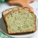 a pinterest image for sourdough discard zucchini bread with text overlay.