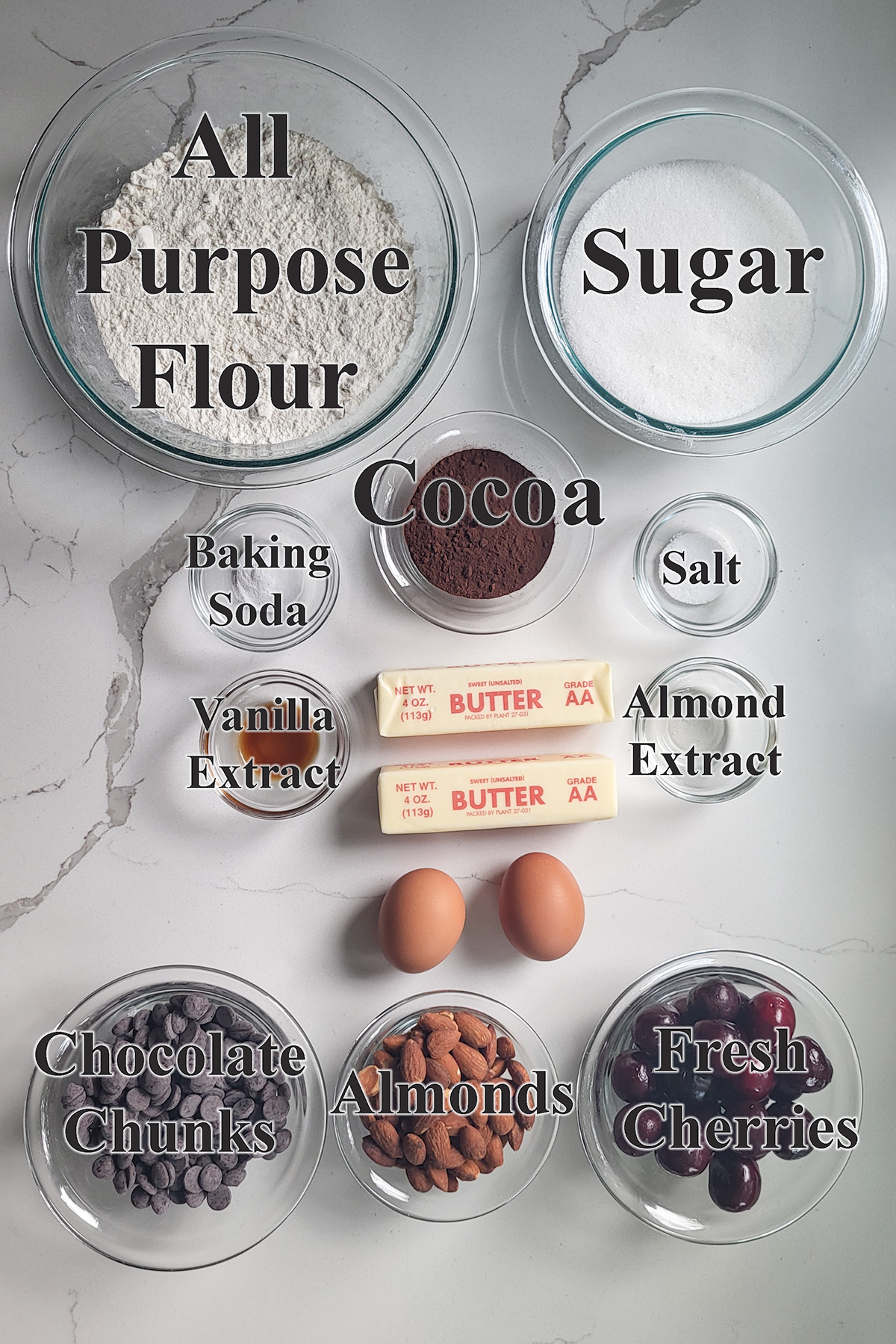 ingredients for cherry chocolate cookies in glass bowls.