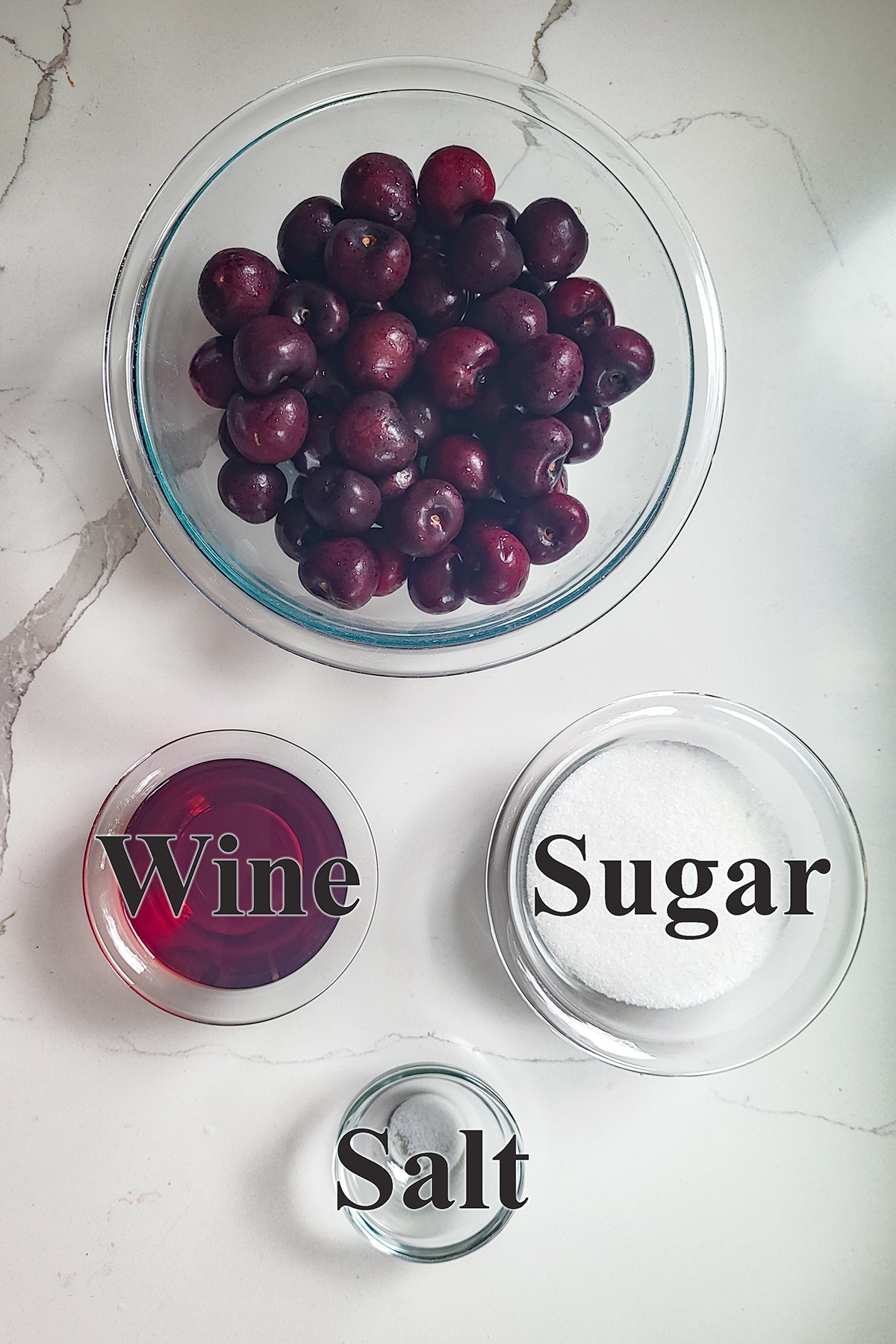 ingredients for cherry sorbet in glass bowls.