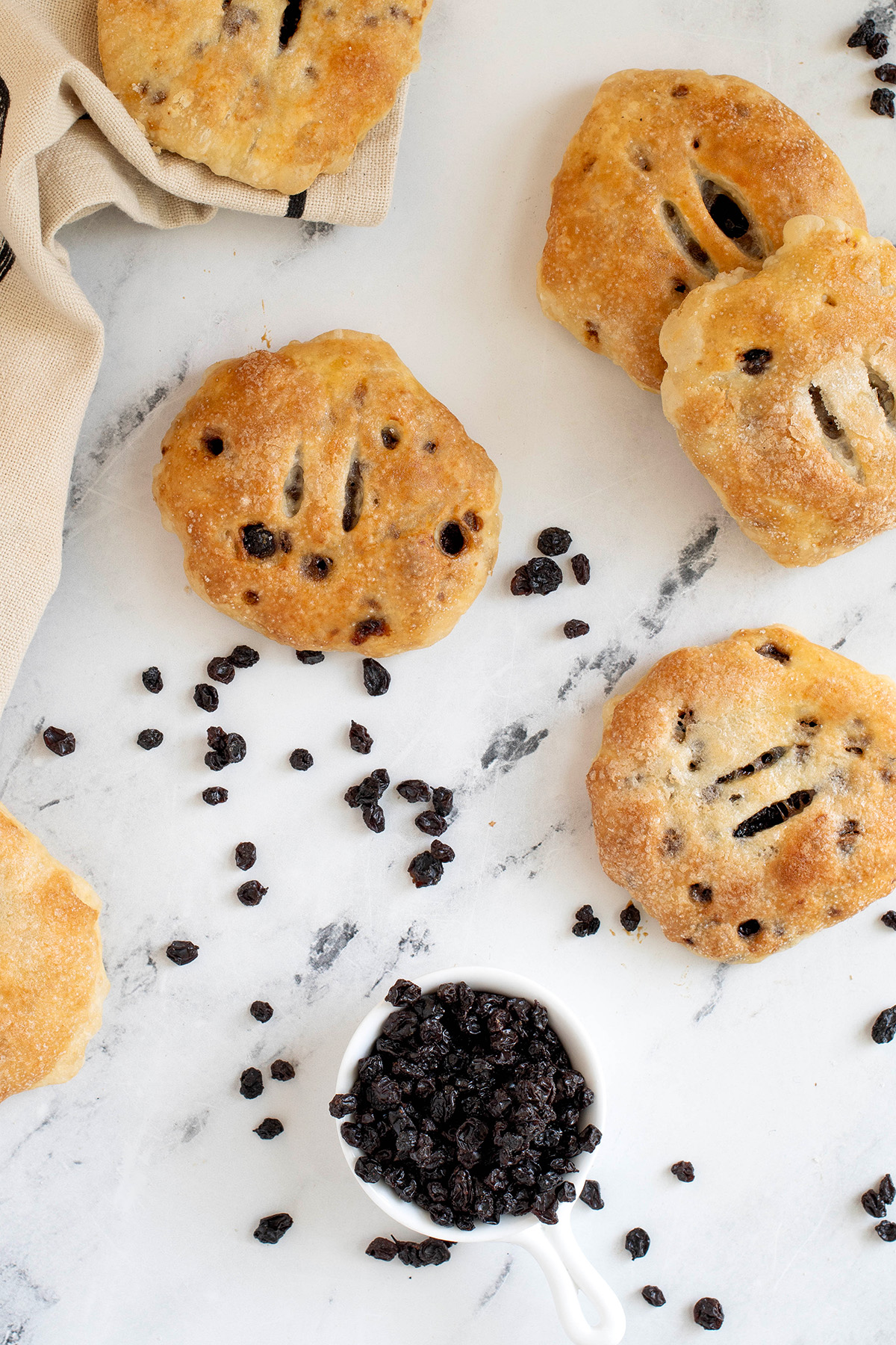 eccles cakes on a white surface.