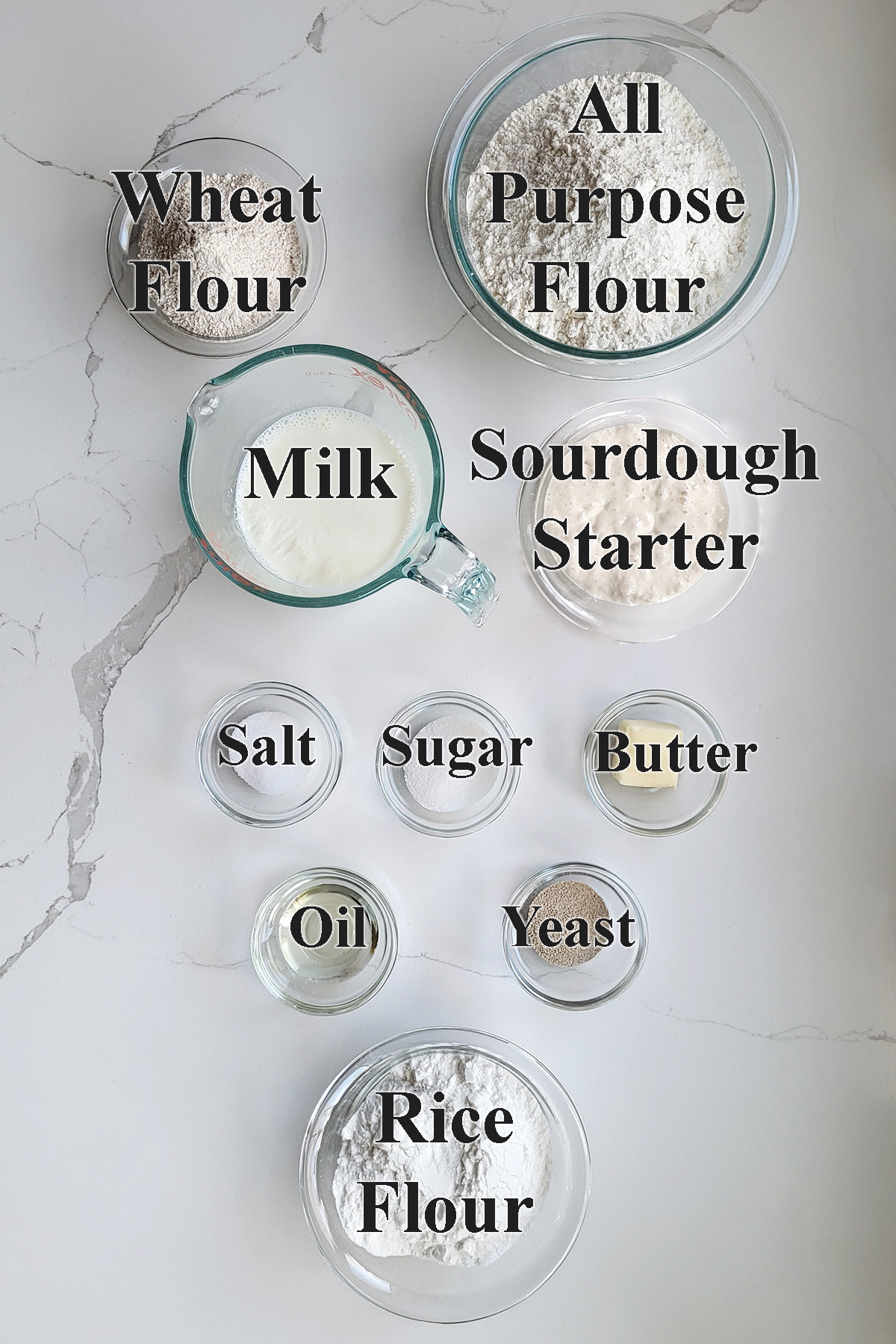 ingredients for sourdough dutch crunch bread in glass bowls.