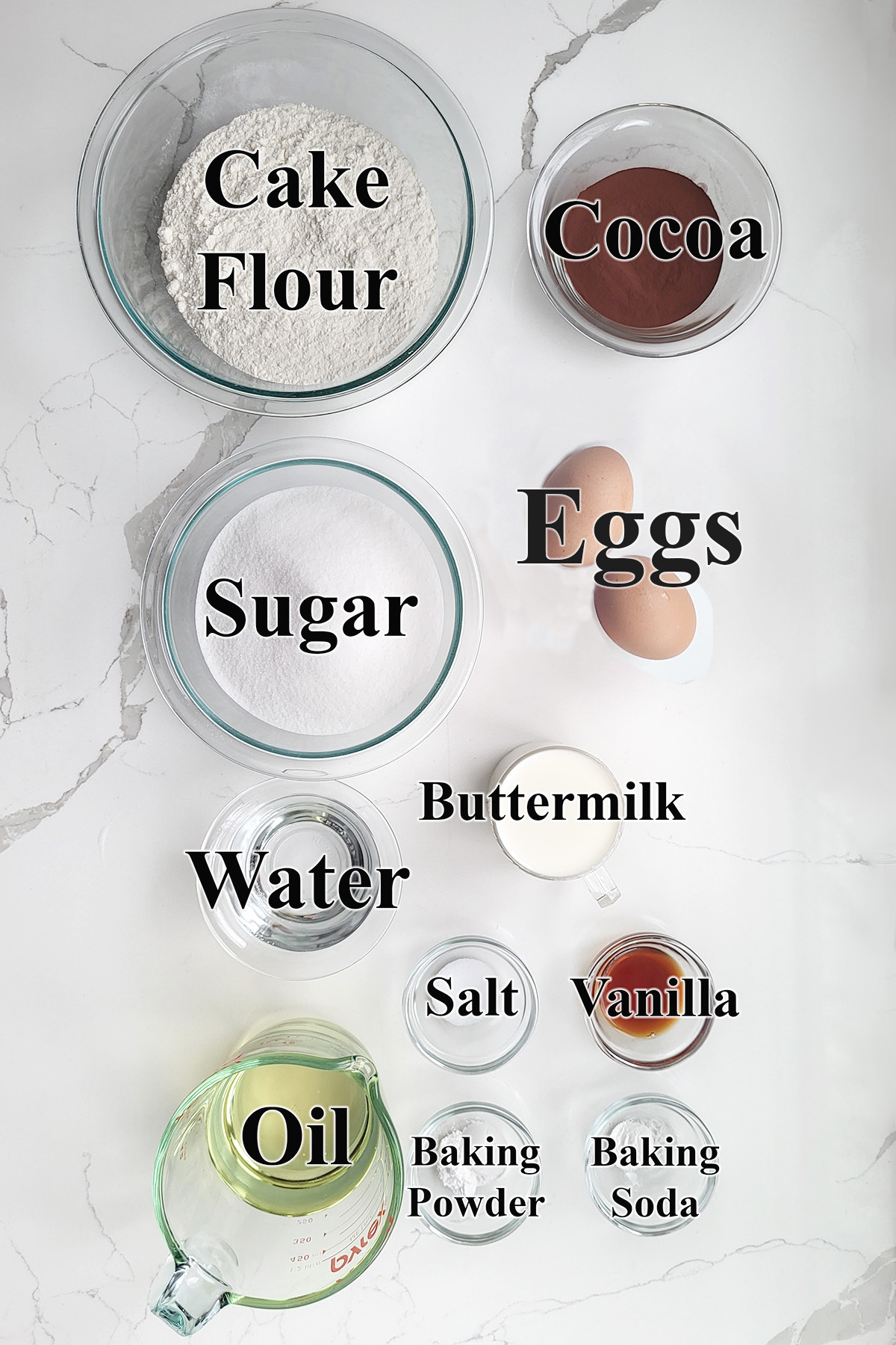 ingredients for chocolate cupcakes in glass bowls. 